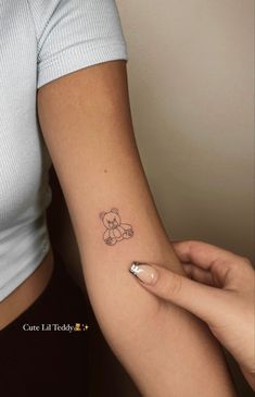 teddy bear tattoo hearts Bear Tattoos Minimalist, Tattoo Ideas Teddy Bears, Minimalist Teddy Bear Tattoo, Dainty Teddy Bear Tattoo, Teddy Tattoo Bear, Teddy Bear Tattoos For Women, Dainty Bear Tattoo, Cute Bear Tattoo For Women, Cool Simple Tattoos For Women