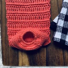 two pieces of crochet are laying next to each other on a cutting board