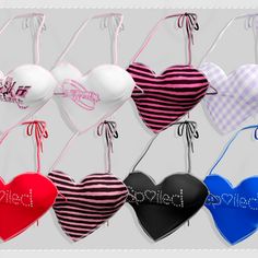 several heart shaped bras hanging from strings with the word love written on them in different colors