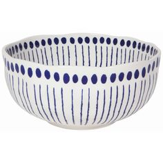 a white and blue bowl with dots on it