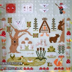 a cross stitch pattern with animals and trees