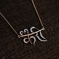 "Hand lettered Hindi name necklace pendant, crafted in 14k solid gold and genuine natural diamonds, this personalized necklace makes a unique customized gift for one and all. * Diamond Wt : 0.21-0.25 ct (approx) * Diamond Color-Clarity Grade : H I -Vs Si * Gold - 2.5g, 14k yellow gold * Pendant Width : 1 inch * Pendant Height : Will vary depending on the name length * Chain Length - 14-18\" cable chain P.S. The design will be finalized with you through sketches before starting manufacturing. Fin Customized Elegant Diamond Jewelry, Customized Diamond Necklace For Personalized Gift, Customized Diamond Necklaces For Personalized Gifts, Customized Diamond Jewelry For Personalized Gifts, Engraved Diamond Necklace Gift, Customized White Gold Diamond Necklace, Elegant Customized Diamond Necklace, Diamond Nameplate Necklace As A Gift, Diamond Initials Name Necklace As Gift