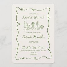 the green and white wedding card features an ornate frame