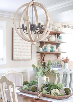 the dining room table is decorated with succulents