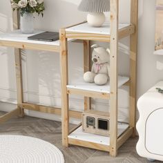 a white teddy bear sitting on top of a shelf next to a lamp and radio