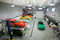 a garage filled with lots of different colored cars