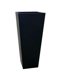 a tall black vase sitting on top of a table