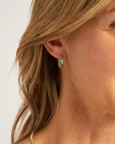 Our Stone Embellished Hoops feature a classic hoop shape decorated with green zircon stones and a signature 14K gold petroglyph. This style is perfect for everyday wear or formal occasions. Metal: Sterling silver with 14K gold accents Stone: Green zircon Dimensions: 16mm x 14mm Style #: E237Gz Green 14k Gold Hoop Earrings, Fine Jewelry With Channel Set Green Stones, Fine Jewelry Green Channel Set, Fine Green Jewelry With Channel Set, Elegant Green Huggie Jewelry, Timeless Tsavorite Green Jewelry, Green Channel Set Fine Jewelry, Elegant Green Hoop Earrings For Formal Occasions, Green Tarnish-resistant Huggie Jewelry