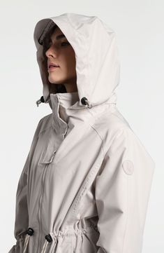 Travel confidently and comfortly in wet weather with this waterproof rain jacket designed for easy packing and breathability. 35" front length; 38" back length (size Medium) Drawcord-toggle hood Drawcord-toggle waist Waterproof Lined 100% polyester Machine wash, tumble dry Imported Nylon Outerwear With Storm Flap For Rainy Weather, Casual Nylon Raincoat With Storm Flap, Nylon Raincoat With Storm Flap For Rainy Weather, Functional Waterproof Raincoat For Rainy Season, Beige Long Sleeve Raincoat For Rainy Weather, Beige Long Sleeve Raincoat, Nylon Parka For Rainy Weather, Casual Nylon Raincoat For Rainy Weather, White Nylon Travel Outerwear