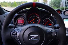 the steering wheel and dashboard of a car