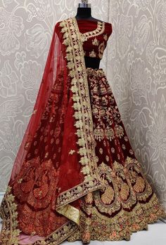 Heavy Designer Wedding Wear Lehenga Choli. FABRIC: Velvet DUPATTA: Soft Net COLOR: Maroon WORK: Heavy Thread Embroidered Work Bonus offer - Receive a free mystery gift with your order. Stitching Option - We will email you the measurement guide to confirm your size. SHIPPING: The product will be shipped within 1 - 2 weeks from the date of purchase. Product is returnable if un-Stitched This product qualifies for free shipping For any Rush/Urgent orders please email us at customercare@desiroyale.co Lehenga Patterns, Barat Dresses, Maroon Bridal Lehenga, Orang India, Bridal Lehenga Online, Red Lehenga Choli, Designer Bridal Lehenga Choli, Ear Tattoos, Latest Bridal Lehenga