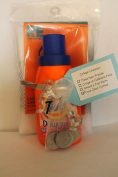 an orange bottle and some coins in a plastic bag with a tag on the side