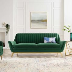 a living room with green couches and chairs in front of a fire place on the wall