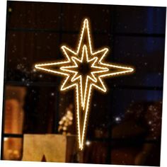 a lighted christmas ornament in the shape of a star