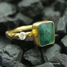 "ARTSMYRNA METAL: 925k Silver GEM: Emerald ( lab created ) Diameter Stone Size: 12x12 mm COATING: 24k gold over (We can made a special type of coating for your personal preference ) MATERIEL : 925K Sterling Silver ( Some of my items vermeil gold over silver for looks rich . But i can finish in silver too ) RING SIZE: 6 (your desired size is made) Features It is the divine gem of Goddess Venus. It is also known as \"Healer Stone\". It has the ability to maintain emotional, physical and spiritual Minimalist Handmade Rings For May Birthstone, Minimalist Handmade Rings With May Birthstone, Minimalist Handmade May Birthstone Rings, Unique 14k Gold Emerald Ring As Gift, Handmade Green May Birthstone Ring, Unique Emerald Ring With Bezel Setting Gift, Handmade Green Birthstone Ring For Anniversary, Handmade 14k Gold Emerald Ring For Anniversary, Heirloom Style Green Emerald Ring As Gift