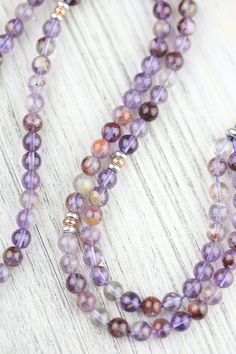 We are so excited to introduce our DharmaShop exclusive Super Seven Mala! Hand strung here in Detroit with genuine Super Seven beads from Brazil and a faceted Amethyst gemstone pendant from Nepal. Super Seven is a rare mineral made from a blend of seven crystals including: Amethyst, Clear Quartz, Smoky Quartz, Cacoxenite, Rutile, Geothite, and Lepidocrocite. This incredibly powerful stone combines the healing properties of all seven crystals! Super Seven is believed to energize and heal all seve Large Bracelet, Adjustable Knot, Seven Chakras, Small Bracelets, 12 Zodiac Signs, Mala Bracelet, Protection Bracelet, Amethyst Pendant, Amethyst Gemstone