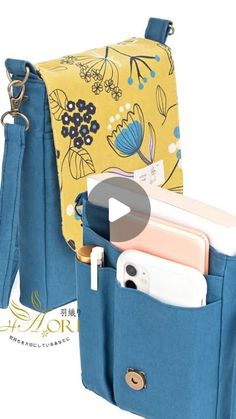 an image of a blue purse with cell phones in it and the inside pocket open