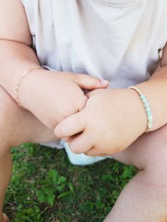 "Jade Baby Bracelet/ Green Beaded Toddler Bracelet/ Personalized Baby Bracelet/ Baby Girl Bracelet/ Toddler Bracelet with Initial Beautiful bracelet is made from 4mm Natural Burma Jade Beads. On each side of the Jade beads, 14 K Gold Filled beads adorn this elegant bracelet. Listing is for one jade bracelet. Option to add disc charm is additional The disc charm is 14 K gold filled also. Initial of choosing is stamped on disc. Bracelet comes with adjustable slide clasp. The clasp simply slides up Adjustable Beaded Heart Bracelet For Birthday, Adjustable Heart Bracelet With Round Beads For Birthday, Adjustable Pink Bracelet For Playtime, Pink Adjustable Bracelet For Playtime, Adjustable Pink Bracelets For Playtime, Adjustable Hypoallergenic Charm Bracelet For Birthday, Adjustable Hypoallergenic Charm Bracelet For Birthdays, Adjustable Dainty Beaded Bracelets For Birthday, Dainty Adjustable Beaded Bracelets For Birthday