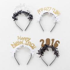 four new year's headbands with gold and white decorations on them, one is happy new year