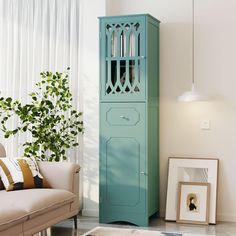 a living room with a blue cabinet next to a couch