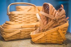 two wooden baskets sitting on top of a counter