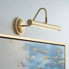 a wall light mounted on the side of a painting