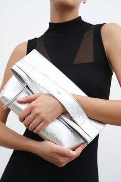 Classic Clutch With Palladium Hardware, Chic Leather Clutch With Palladium Hardware, Classic Leather Clutch With Silver-tone Hardware, Leather Clutch With Fold Over Clasp For Party, Everyday Luxury Leather Clutch, Formal Leather Clutch With Silver-tone Hardware, Chic Silver Clutch With Silver-tone Hardware, Chic Textured Leather Clutch For Party, Elegant Silver Leather Clutch