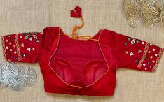 Stunning red mirror work saree blouse. Buy designer blouse in USA from Pure Elegance. Disclaimer: The actual product may vary slightly from the image. These are custom orders, hence expect slight variation in color, placement of the motif or buta. ESTIMATED DELIVERYBecause this is a custom order, it would take about 4 weeks from the date of purchase. RETURN POLICY: This product is a custom order and cannot be returned or exchanged. Designer Red Saree With Mirror Work, Red Fitted Sets With Mirror Work, Designer Red Blouse Piece With Mirror Work, Red Unstitched Blouse Piece For Transitional Season, Designer Red Blouse Piece For Festivals, Red Chanderi Blouse For Transitional Seasons, Transitional Red Unstitched Blouse Piece, Transitional Red Chanderi Blouse, Red Designer Tops For Festivals