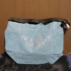 Very Cute Denim Tote Bag By Victoria Secret. Has A Pocket On Each Side Of The Bag. Also Has Cute Studs All Along The Bag. Brand New!! Excellent Condition! Measures 19 Inches Across And 13 Inches Down. Please Check Out My Closet, And Consider Bundling For Additional Savings. Thank You For Poshing With Me. Free Gift With Every Purchase Trendy Large Capacity Shoulder Bag From Victoria's Secret, Denim Blue Canvas Shoulder Bag For Shopping, Trendy Blue Canvas Bag For Errands, Trendy Victoria's Secret Large Capacity Shoulder Bag, Trendy Large Capacity Victoria's Secret Shoulder Bag, Trendy Victoria's Secret Shoulder Bag For Errands, Casual Victoria's Secret Shoulder Bag For Everyday Use, Victoria's Secret Casual Shoulder Bag For Everyday Use, Victoria's Secret Casual Bags For Daily Use