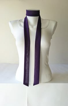 "This purple skinny scarf is made of an beautiful crepe chiffon fabric. It is sewn with a double layer, no raw edges or open seams. It has angled ends. You can wrap skinny scarf around your neck in one of many different ways. It can be use as a headband and belt also. Details: ♥ The skinny scarf has been sewn in double layer, no raw edges or open seams. ♥ Material: Crepe chiffon fabric (lightweight polyester) ♥ Color: Purple ♥ Measurements; ~ Length: 63 inches  ~ Width: 1.5 inches  ♥ Care: Hand Womens Neck Tie, Scarf Choker, Narrow Scarf, Become A Fashion Designer, Cold Fits, Purple Scarves, Tie Styles, Womens Tie, Neck Scarves