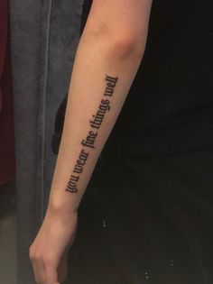 a person with a tattoo on their arm that says don't touch the things