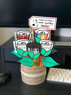 there is a vase with pencils and markers in it