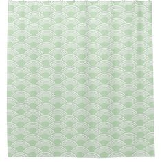 a shower curtain with an abstract design in mint green and white, on a white background