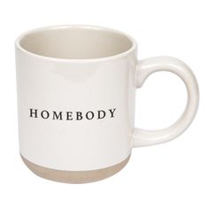 a white coffee mug with the words home body printed on it