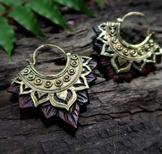 ･⋆｡ Welcome to My Enchanted Jewelry Market｡⋆･ We are glad you found us♥ We are a small market in a forest where fairies and spirits of nature come around. Our jewellery is hand made from very skilled carvers from our tribe in the forest🌿 These lotus tribal earrings are hand carved from wood and cast in brass.     SIZE    Approx 5.5cm from top to tip, 5.5cm wide      MATERIALS     Wood and Brass 🎁Gift wrapping included with every item purchased. ⭐ More organic jewellery ⭐ https://www.etsy.com/a Artisan Jewelry With Artistic Design For Festivals, Nature-inspired Brown Jewelry For Festivals, Bohemian Earrings With Unique Design For Gift, Bohemian Handmade Earrings For Rituals, Handmade Nature-inspired Earrings For Festival, Fair Trade Nature-inspired Jewelry For Gifts, Nature-inspired Fair Trade Jewelry For Gifts, Bohemian Brown Ceremonial Jewelry, Handmade Nature-inspired Festival Earrings