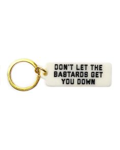 Don't let 'em get to ya, a handy reminder to carry with you all day.Simple, classic tag keychainGlossy durable, hard plastic bodyDesign printed on one sideWould work great as a bag pull, too!Measurements: 2" x .75" w/out key ringBy Golden Gems Cool Accessories, Body Design, Zulu, Bits And Bobs, Pretty Words, Hard Plastic, Don't Let, Things To Buy, Key Rings