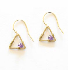 These Tiny Triangle Earrings are small, simple and stunning. The small flash of each stone color adds an accent of color to your day and the ever popular triangle shape is always great to adorn your ears with. These earrings are made with gold fill ear hooks, brass components, and semi-precious stones. Brass Components, Triangle Earrings, Semi Precious Stones, Ear Hook, Triangle Shape, Book Decor, Jewelry Projects, Semiprecious Stones, Precious Stones