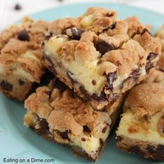 chocolate chip cookie cheesecake bars on a blue plate