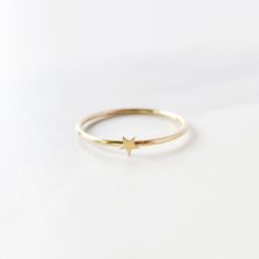 A super cute, tiny star ring looks great alone or stacked up! All 14K Gold Filled Made from 1mm full round wire. Star is 2mmComes in sizes 5-9Gold Filled has 100 times more gold than gold plated jewelry. Gold filled wire is created by taking a sheet of 14 karat gold and bonding it through extreme heat and pressure to a core of semi-precious metal (brass). This is a very sophisticated process and only a few mills in the world do it. You should not mistake this process for gold plating as there is Gold Star-shaped Everyday Rings, Minimalist Star-shaped Midi Rings For Gifts, Minimalist Star-shaped Midi Rings As Gift, Minimalist Gold Star Shaped Rings, Dainty Star-shaped Promise Ring, Minimalist Gold Star Rings, Dainty Star Shaped Promise Ring, Minimalist Star Shaped Rings For Everyday, Minimalist Star-shaped Rings For Everyday