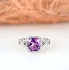 Gorgeous cushion cut amethyst ring is made of 925 solid sterling silver, making a simple but elegant statement piece. This ring is perfect to wear as engagement ring, promise ring, birthstone ring, or statement piece. ►Average band width: 2.3 mm ►True to size. ►Your sterling silver ring will not turn green itself and will not cause your skin to turn green. Center Stone: Amethyst Shape: Cushion Size: 8.0 x 8.0 mm Carat Weight: 2.5 ct. (approx.) Gemstone creation: Natural Hardness: 7 (Mohs scale) Classic Amethyst Diamond Ring With Halo Setting, Classic Amethyst Promise Ring With Center Stone, Cushion Cut Amethyst Ring With Center Stone For Wedding, Elegant Amethyst Ring With Halo Design For Anniversary, Fine Jewelry Amethyst Ring With Halo Design For Anniversary, Wedding Amethyst Diamond Ring With Diamond Accents, Elegant 14k White Gold Amethyst Wedding Ring, Elegant Amethyst Halo Ring For Anniversary, Wedding Amethyst Diamond Ring With Accents