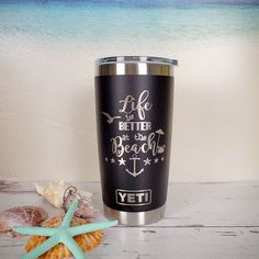 a stainless steel tumbler with the words life is better at the beach on it