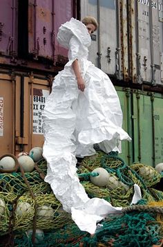 A Vancouver-based fashion designer has turned the white, plasticky weather-barrier material normally found at construction sites into her medium of choice for everything from men's costumes to wedding dresses. Men's Costumes, Things To Do In Vancouver, Art Dresses, Origami Fashion, White Dinner, Paper Fashion, Vancouver Bc Canada, Restaurants Food