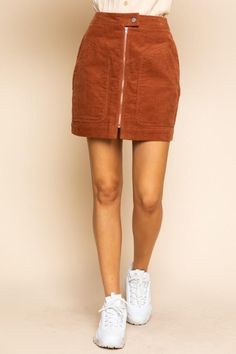 This corduroy mini skirt is a perfect match for a walk. Features high waist fit and an exposed front zipper with big patch pockets. High-Waisted Fit A-Line Short Length Button Closure Exposed Front Zipper Front Patch Pockets Back Welt Pockets Soft Corduroy Unlined 100% Cotton Hand Wash Cold, Lay Flat to Dry Imported Small: Length 17" Waist: 27" Medium: Length 17.5" Waist 29" Large: Length 18" Waist 31" . Garage Corderoy Skirt, Casual Corduroy Mini Skirt With Pockets, Fall Corduroy Skirt With Pockets, Casual Brown Corduroy Skirt, Brown Corduroy Casual Mini Skirt, Corduroy Lined Skirt Bottoms For Fall, Casual Brown Corduroy Mini Skirt, Fall Corduroy Mini Skirt With Lining, Casual Corduroy Skirt For Fall