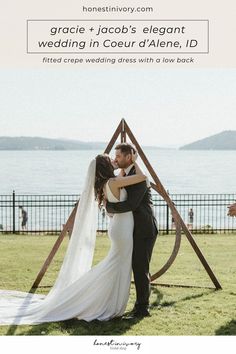 a bride and groom kissing in front of the ocean with text overlay that reads grace + jacob's elegant wedding in court d'alene, id