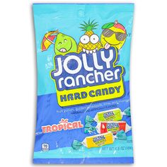 jolly rancher hard candy with tropical flavor on the front and blue packaging behind it