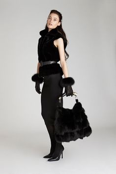 If you're looking for a fur handbag that you won't see everywhere else, this is it! Our black fox fur handbag features a unique design including a real Argentine cow horn handle. 15% off your first purchase! Free shipping over $100; 30-day returns. Order online today. Luxury Faux Fur Evening Bag, Luxury Evening Bags In Faux Fur, Luxury Black Shoulder Bag For Winter, Elegant Evening Shoulder Bag With Faux Fur Lining, Winter Evening Bag In Faux Fur, Winter Evening Bags With Faux Fur, Winter Evening Bags In Faux Fur, Elegant Winter Shoulder Bag With Faux Fur Lining, Elegant Faux Fur Bags