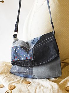 Handmade denim fold over shoulder handbags with a patchwork design combining various denim colours, patterns and bleach techniques. Inside each bag I have complimented the outside with a bright and bold patterned lining. Small size and suitable for small items such as purse, keys and make-up. All items are secure inside this fold over design as each bag has a magnetic fastening which is place at the top of the folded section, with a non-adjustable strap which can fall on the outside shoulder or over the wearers head. Description: Light/Dark/Spotted Denim and Blue with yellow/white Flower and spotted cotton lining.  Measurements: Unfolded length 37cm, Folded Length 22cm, Width 25cm Shoulder Length: Full Length 123cm, Shoulder length 61cm Machine washable - cool wash/iron safe but do not tum Blue Patchwork Shoulder Bag For Everyday Use, Blue Denim Shoulder Bag With Handles, Blue Canvas Patchwork Bags, Blue Patchwork Canvas Bags, Everyday Denim Blue Patchwork Shoulder Bag, Everyday Denim Blue Patchwork Bag, Blue Patchwork Shoulder Bag, Blue Cotton Patchwork Bag, Denim Blue Patchwork Shoulder Bag