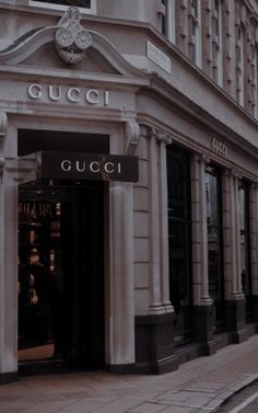 a street corner with a gucci store on it