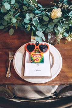 a place setting with sunglasses and napkins