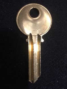 two keys that are on top of each other, one is gold and the other is silver